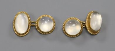 A pair of 9ct gold and oval moonstone cufflinks.ex Congelow House