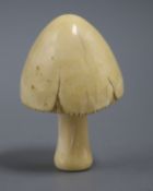 A Japanese Meiji carved ivory mushroom, the stalk screwed to the cap and threaded both ends, H 8.