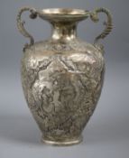 A Persian embossed white metal two-handled vase, 23cm.