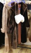 Two fur coats and a fur hat