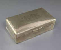 A George V silver mounted presentation cigarette box, 20.5cm