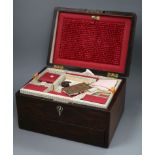 A Victorian rosewood rectangular work box, enclosing a fitted interior with a drawer in the base,