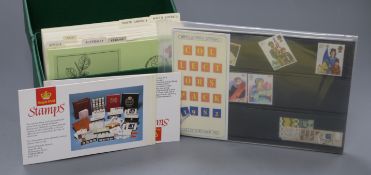 A collection of First Day Covers and coins