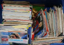 A quantity of football programmes