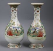 A pair of Japanese porcelain bottle vases, by Kanzan Denshichi, Meiji period, each painted with