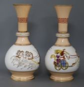 A pair of French porcelain bottle shaped vases, of bulbous form and cylindrical necks, painted