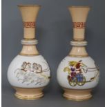 A pair of French porcelain bottle shaped vases, of bulbous form and cylindrical necks, painted