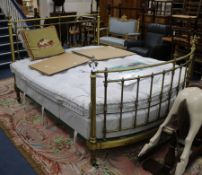 A Victorian brass double bedstead, with tubular headrails and uprights, chased with flowerheads