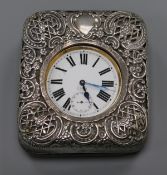 An Edwardian travelling Goliath pocket watch in repousse silver mounted travelling case, William