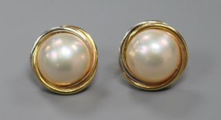 A par of 14ct two colour gold and mabe pearl ear rings, 18mm.
