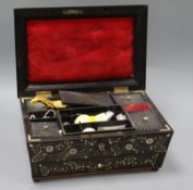 A 19th century, possibly Goanese, ebonised and ivory inlaid work box, with sectioned interior, and