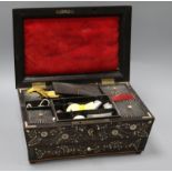 A 19th century, possibly Goanese, ebonised and ivory inlaid work box, with sectioned interior, and