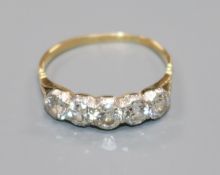 An 18ct gold and graduated five stone diamond ring, size R.