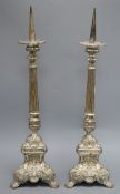 A pair of silver plated on brass pricket candlesticks height 55cm