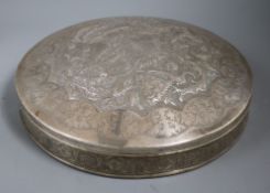 A Persian white metal circular box and cover, embossed with animals and birds, 31.5cm.