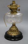 A Victorian brass and glass oil lamp, on black ceramic base height 34cmex Congelow House