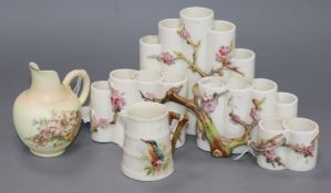 A Royal Worcester 'cluster' of vases, applied with blossoming hawthorn, 24cms, and two Royal