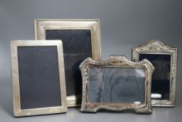 Four assorted modern silver mounted photograph frames including Harrod's Ltd, largest 22.5cm.