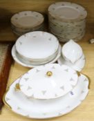 A Limoges part dinner service, white ground with gilt rims, all-over decorated with a gilt