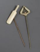Two ivory mounted cricket related stick pins, one modelled as a cricket bat, the other as cricket