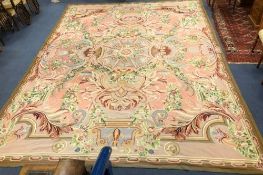 An Aubusson style pink ground carpet 437 x 336cm