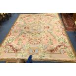 An Aubusson style pink ground carpet 437 x 336cm