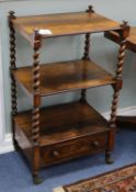 A Victorian rosewood three tier whatnot, on spiral turned and square supports, base drawer, on
