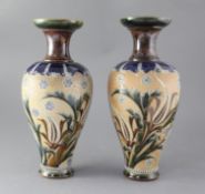 A pair of Royal Doulton stoneware baluster vases, decorated by Eliza Simmance, with stylised foliate