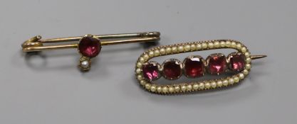 Two Victorian yellow metal, garnet and seed pearl set brooches. largest 39mm.ex Congelow House