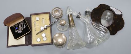 Mixed silver topped bottles and jewellery.