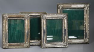 A set of three modern silver mounted photograph frames and one larger frame, Harrod's Ltd,