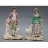 A pair of Victorian bisque figures, ex Geoffrey Godden collection height 18cm