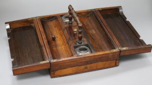 A William IV rosewood writing box, with rectangular double flap lifting top, enclosing covered