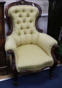 A Victorian mahogany button back armchair with brass presentation plaque relating to Reverend