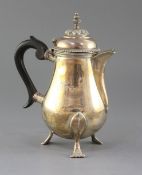 An Edwardian silver hot water pot, Daniel & John Welby, London 1905, gross 19.5 oz.