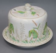 A Victorian Staffordshire pottery circular cheese dish and cover, decorated with fernsex Congelow