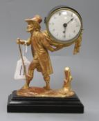 A 19th century French drum cased eight day mantel timepiece, supported by a figure of a man