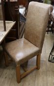 A set of six pale brown leather dining chairs