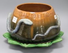 A C.H. Brannam Barum ware brown and green glazed bowl, the body encircled by a snake, together