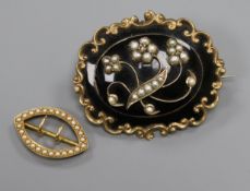 An Edwardian 15ct gold and seed pearl scarf clip and a yellow metal, seed pearl and black enamel