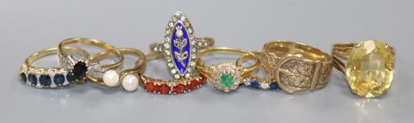 Nine assorted 9ct gold rings including gem set.