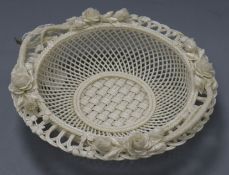 A Belleek white glazed circular basket, the pierced border modelled with roses diameter 22.5cmex