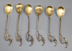 A set of six Swedish parcel gilt white metal and plique a jour enamelled coffee spoons.ex Congelow