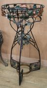 An early 20th century wrought iron plant stand W.61cm