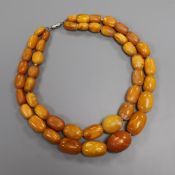 A double strand graduated amber bead necklace, gross weight 91 grams, 42cm.