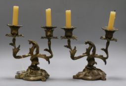 A pair of Louis XV design gilt metal two light candelabra, cast and chased with foliate, height