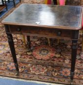 A Victorian mahogany small writing table, with leather inset top and frieze drawer, on turned and