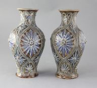 A pair of Doulton Lambeth baluster vases, decorated by Frank Butler, with stylised floral motifs,