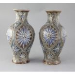 A pair of Doulton Lambeth baluster vases, decorated by Frank Butler, with stylised floral motifs,