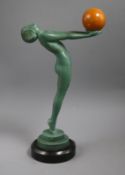 An Art Deco model of a nude holding a ball, signed Max Le Verrier height 33cm